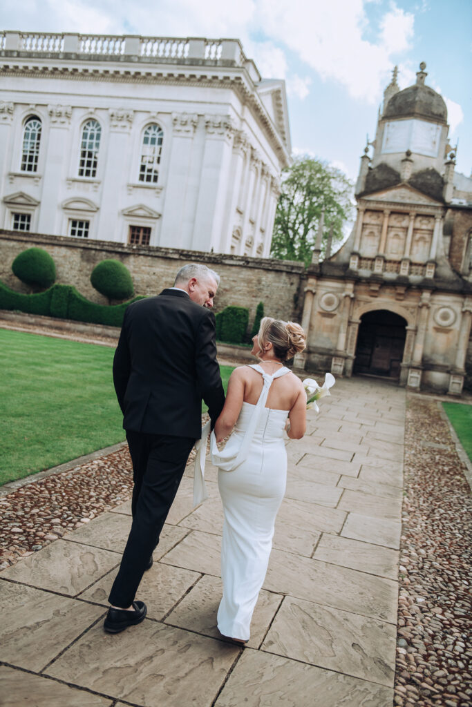 Bride and groom holding bouquet of flowers