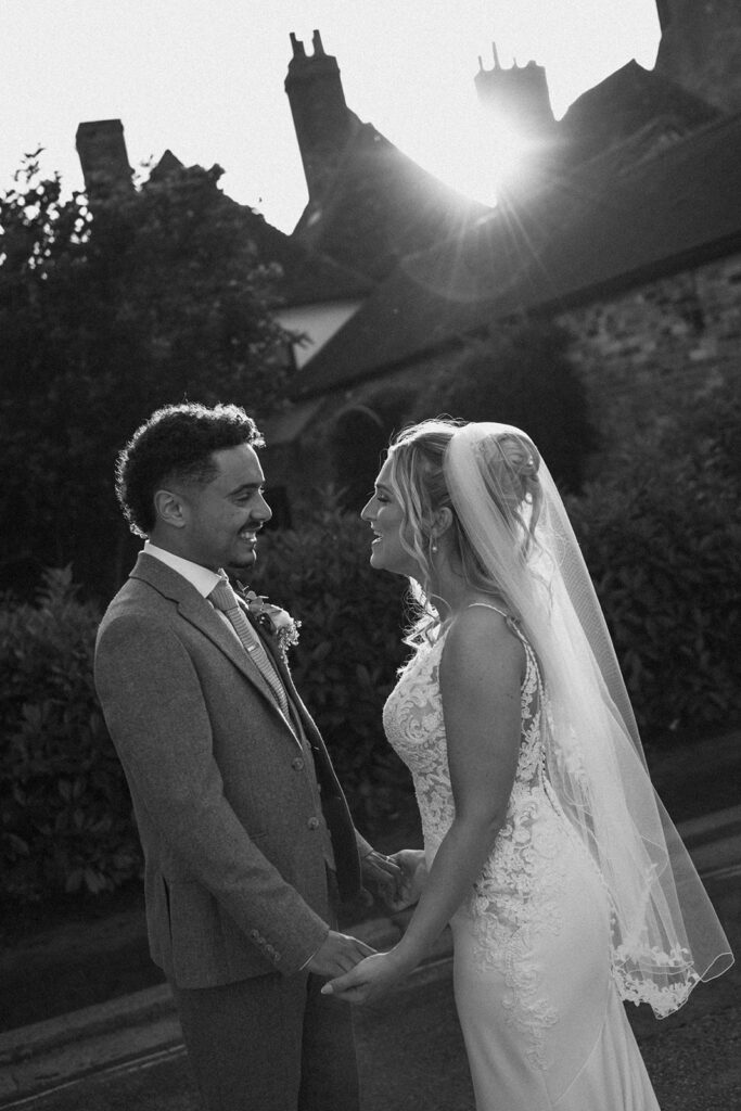 Bride and groom in front of sunset