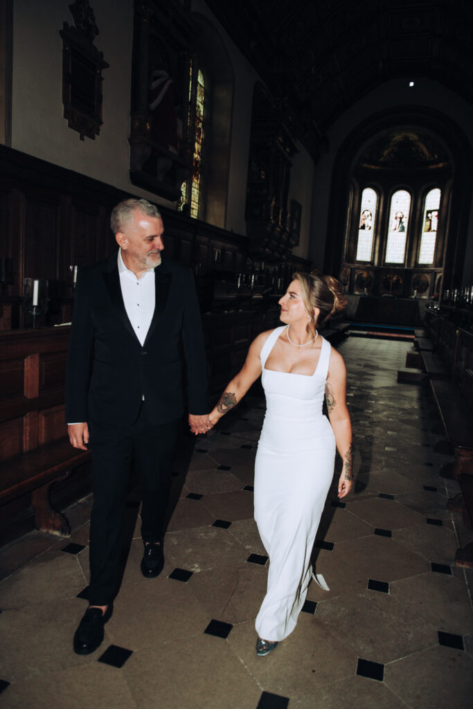 Bride and groom in chapel in gonville & caius college