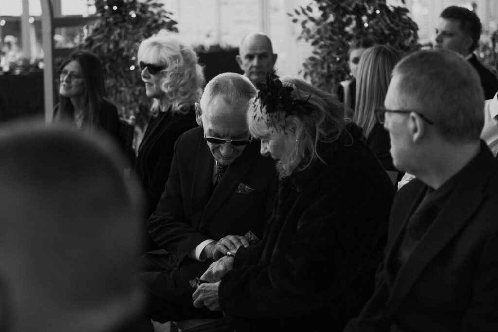 Elderly couple at a wedding