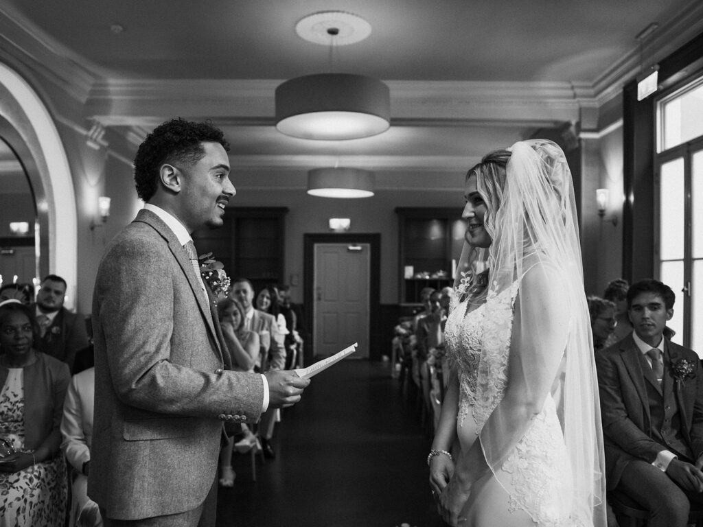 Groom reading vows aloud