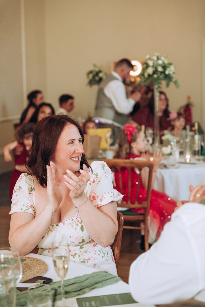 Wedding guest clapping at the bell hotel in Sandwich