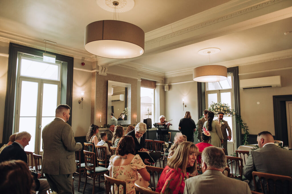 Guests arriving to wedding ceremony at the bell hotel