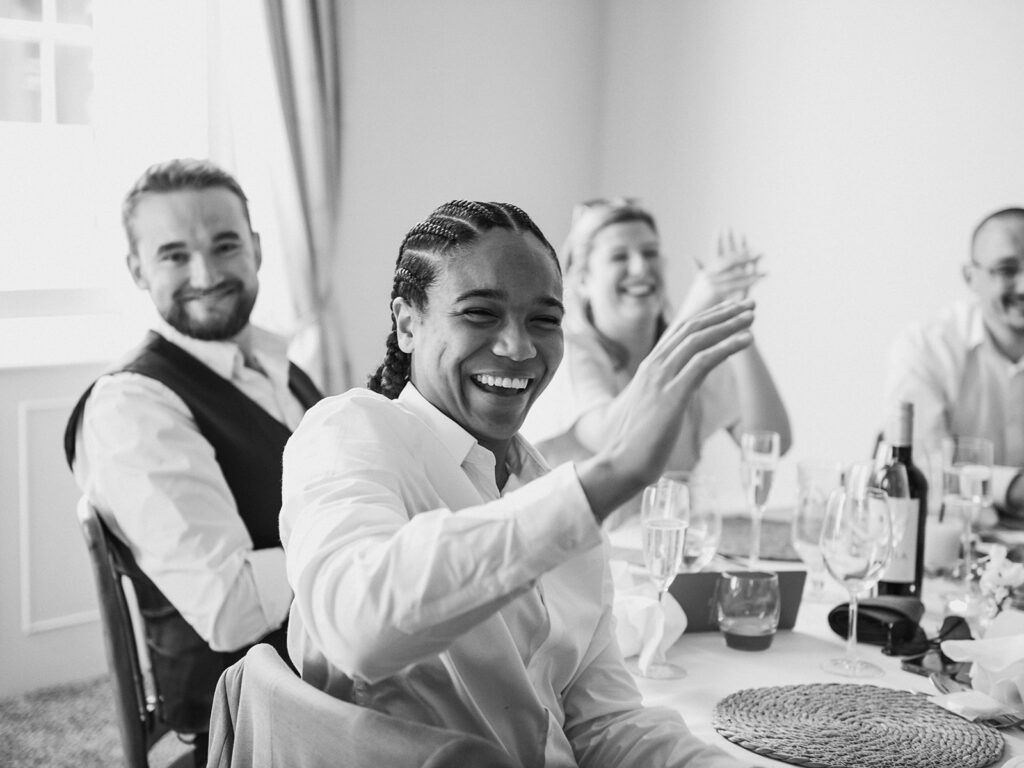 Guests clapping at wedding reception
