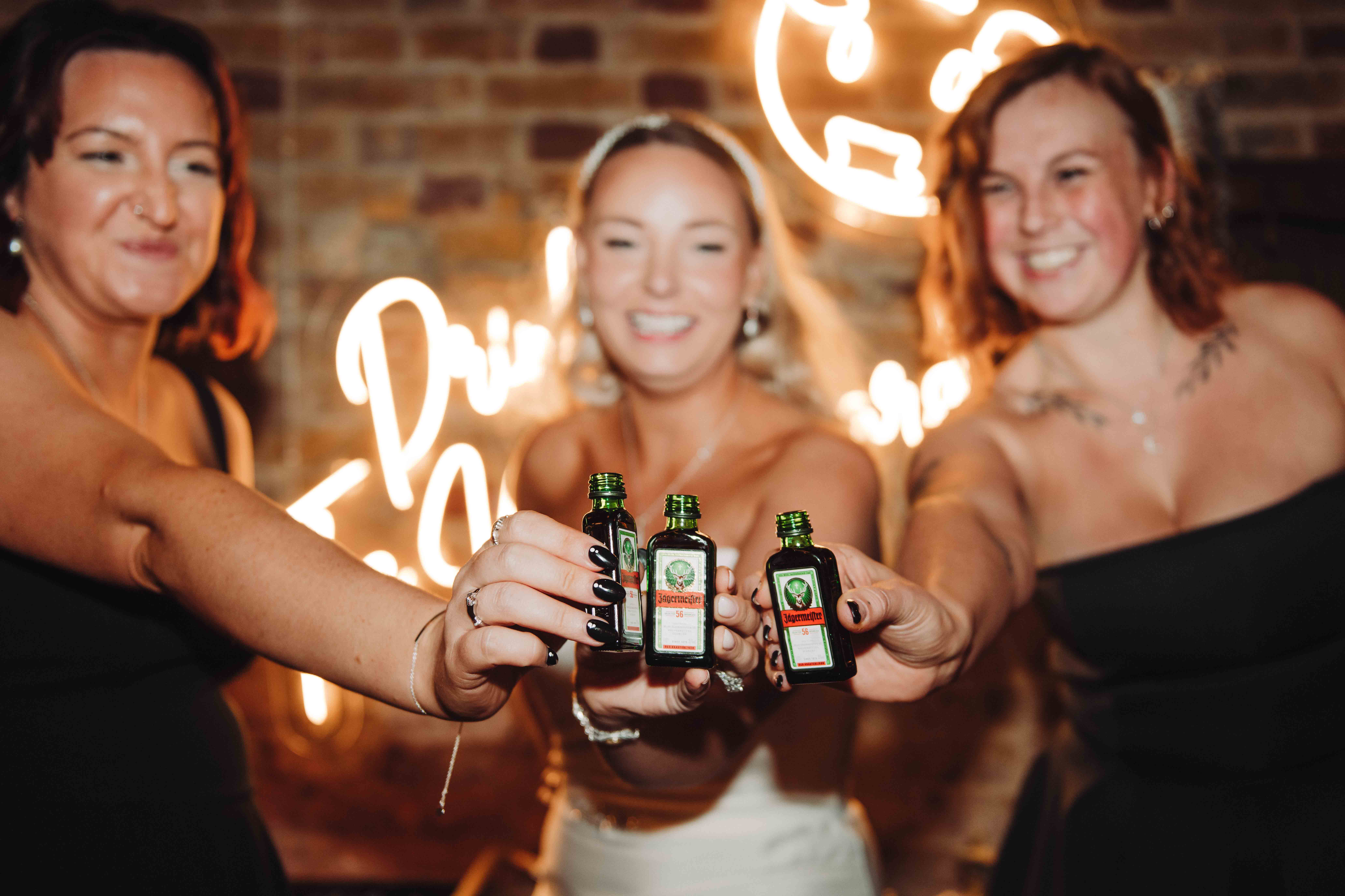 bride and friends doing jager shots