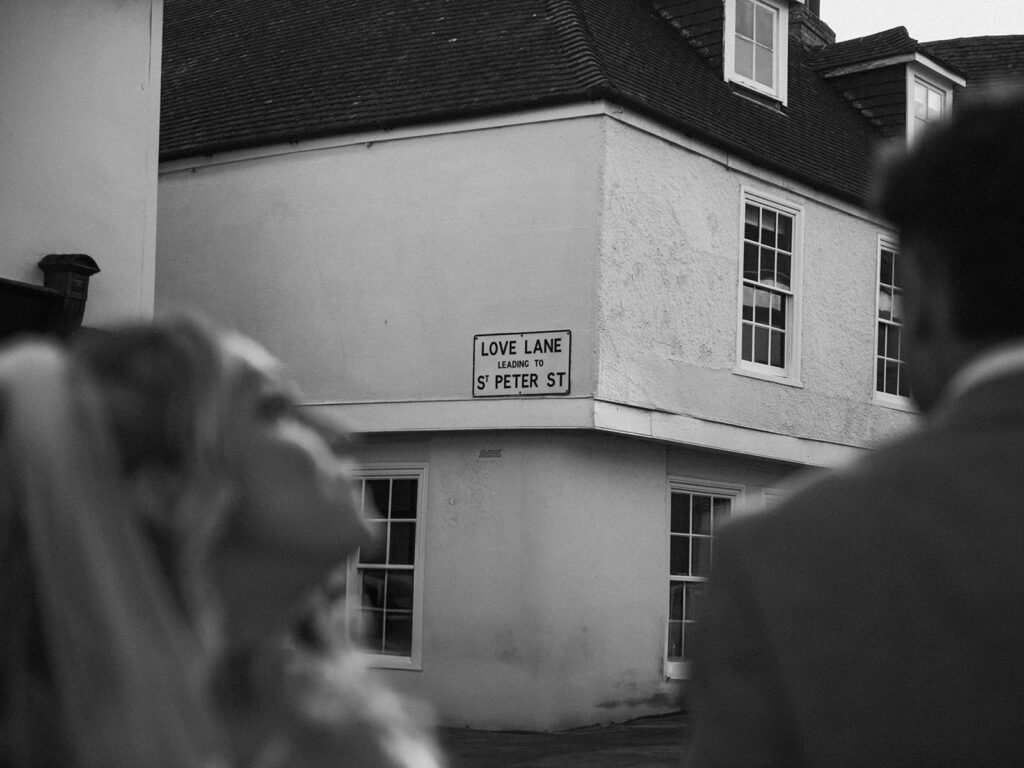 Love lane in Sandwich with bride and groom walking by