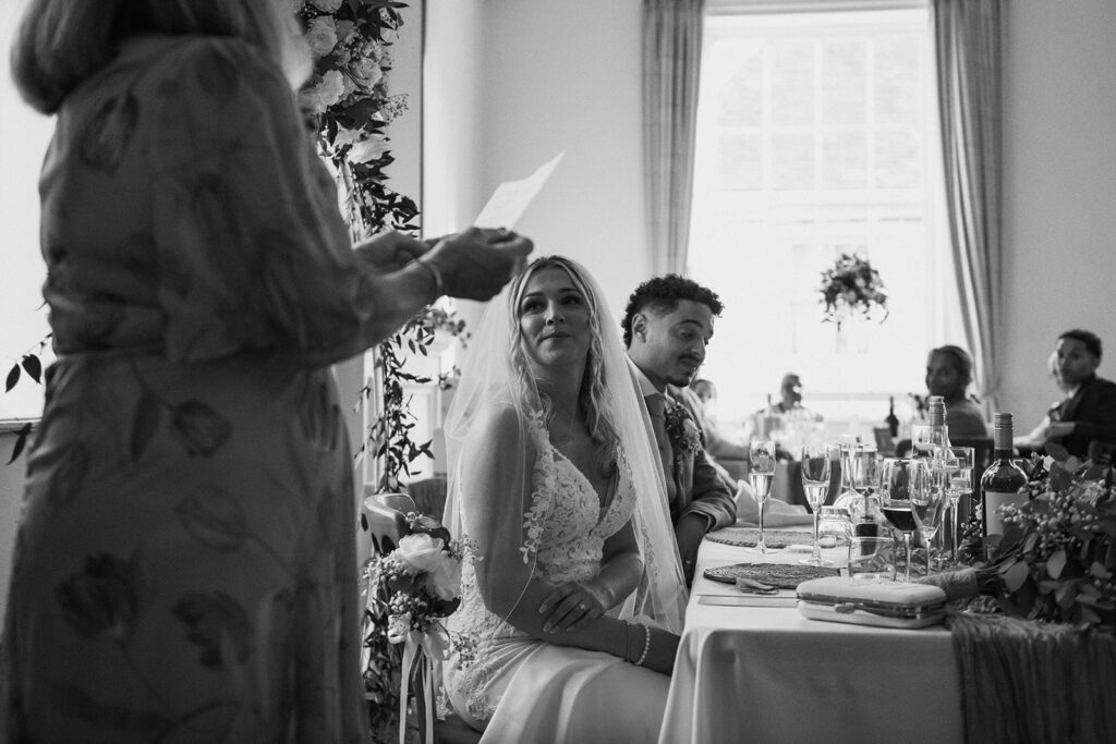 bride listening to mother giving speech