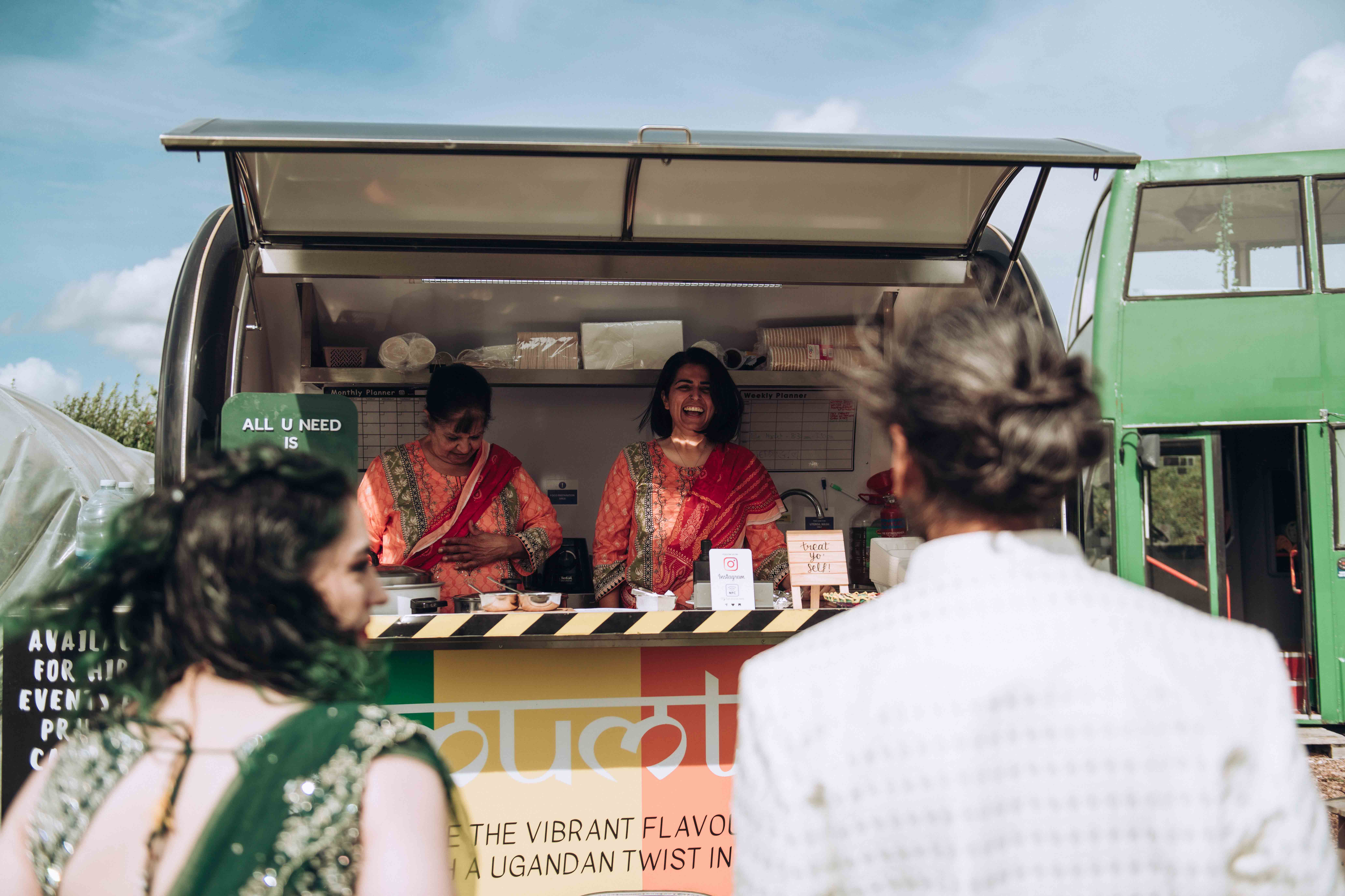 Bride and groom getting food from Mumtas food van