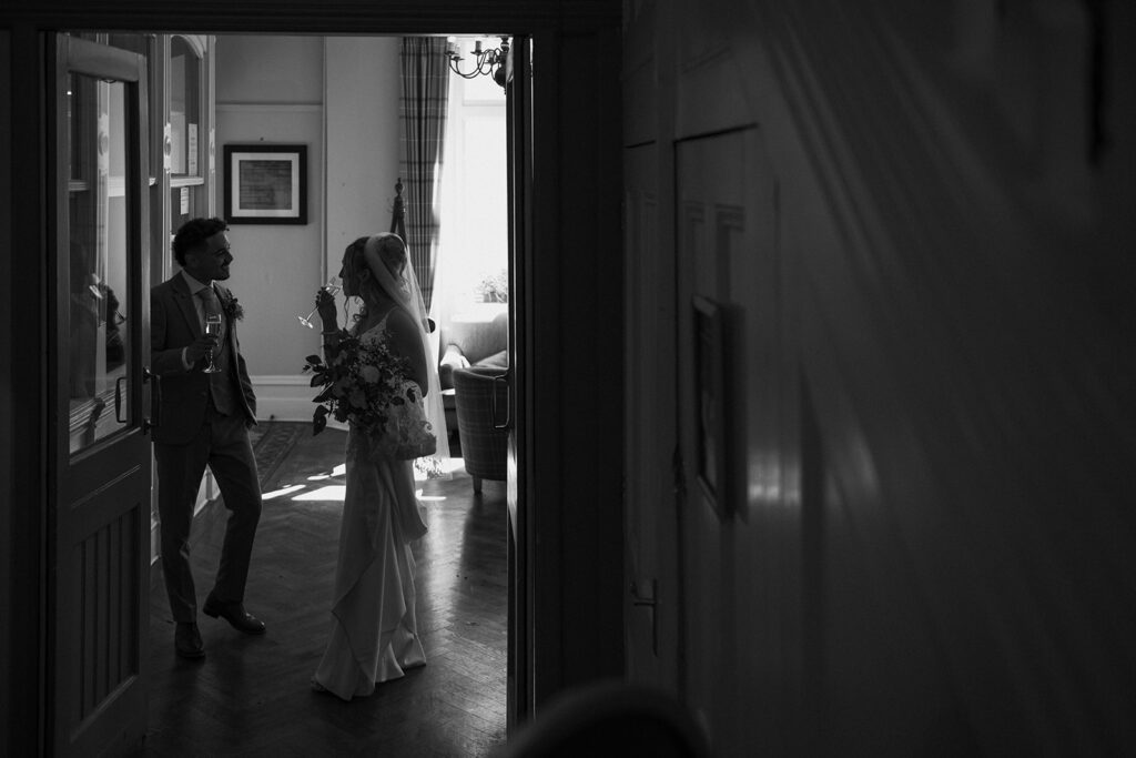 newlyweds chatting in foyer of wedding venue
