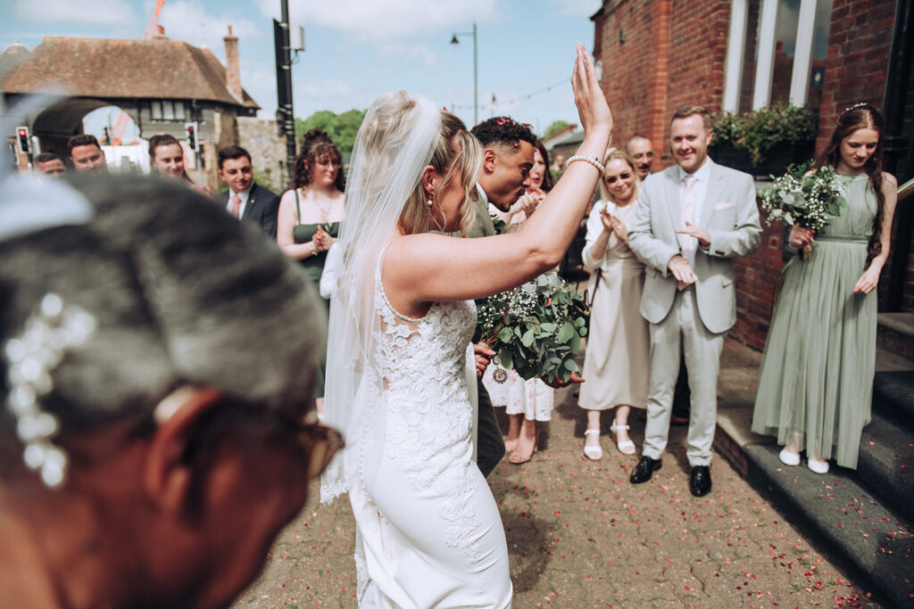 Newlyweds walking into the Bell Hotel