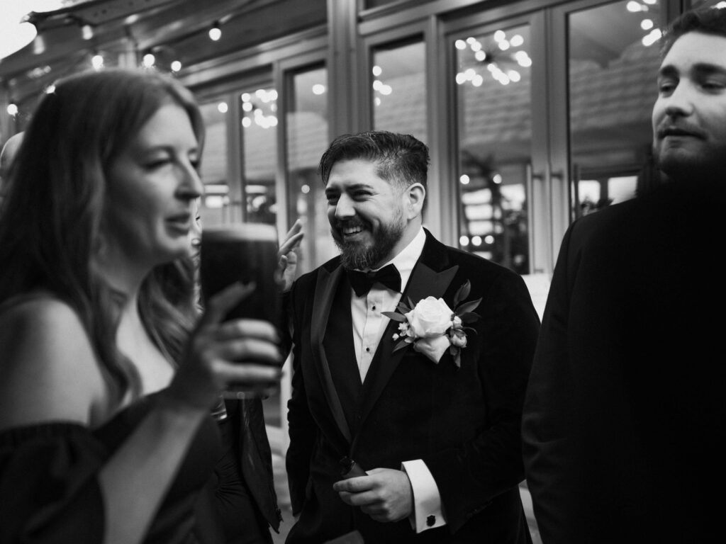 Groom chatting with guests