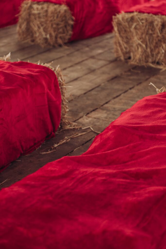 Hay bales with red blanket over
