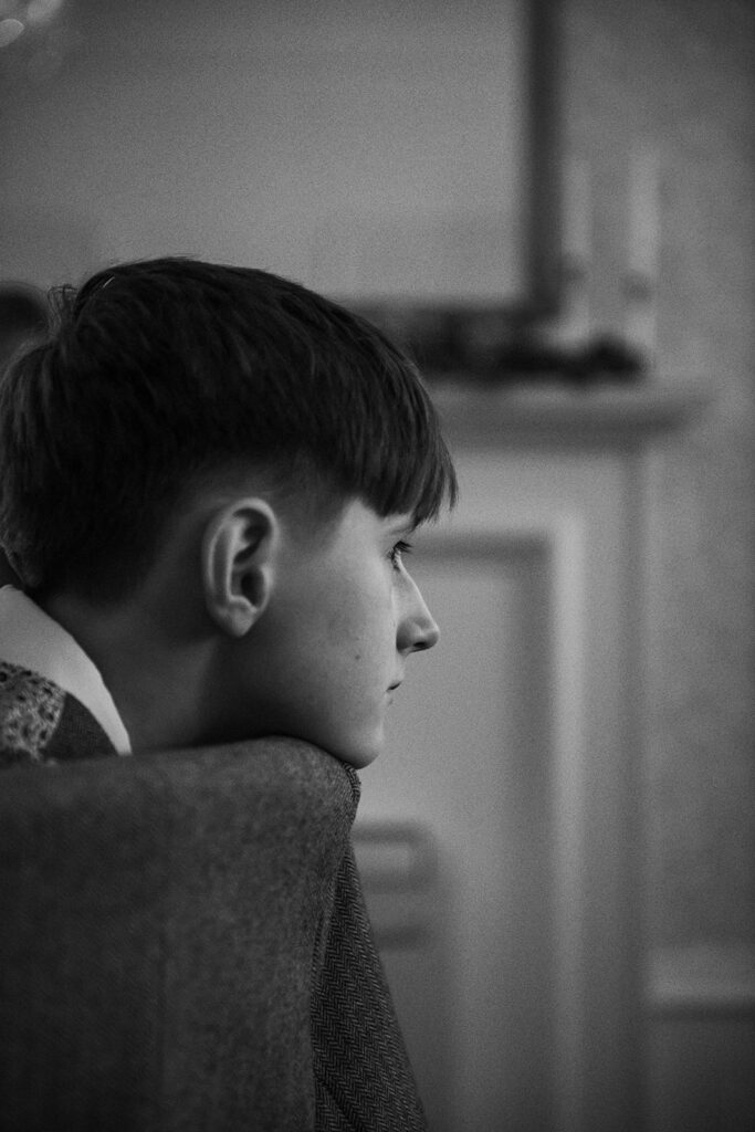 young boy listening to speech