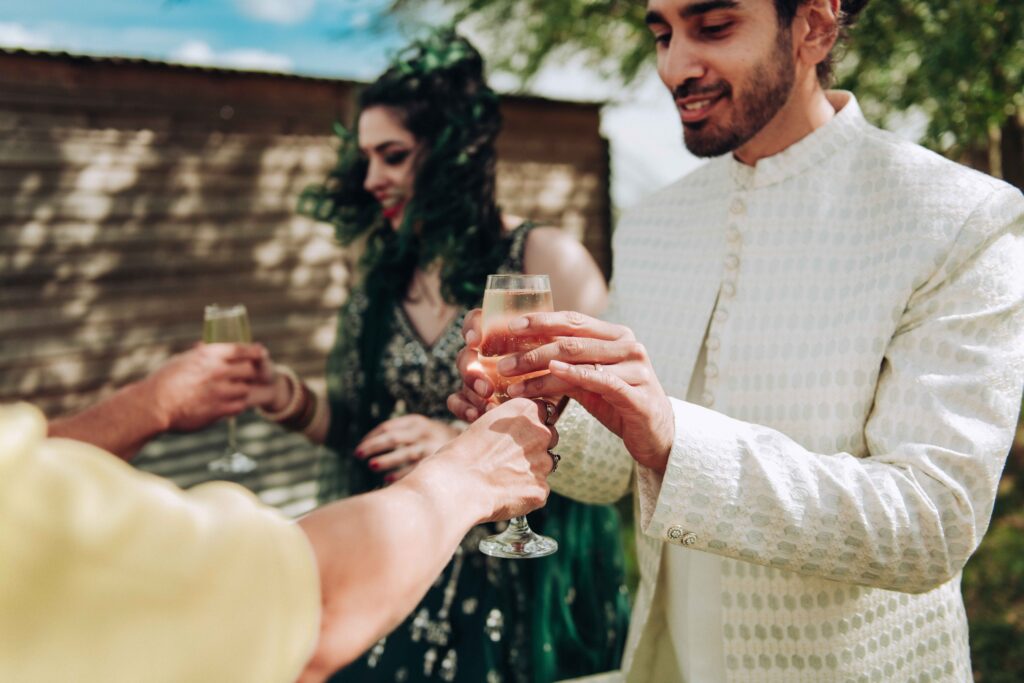 Bride and groom receiving champagne