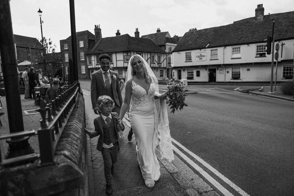 Family walking in Sandwich by the road