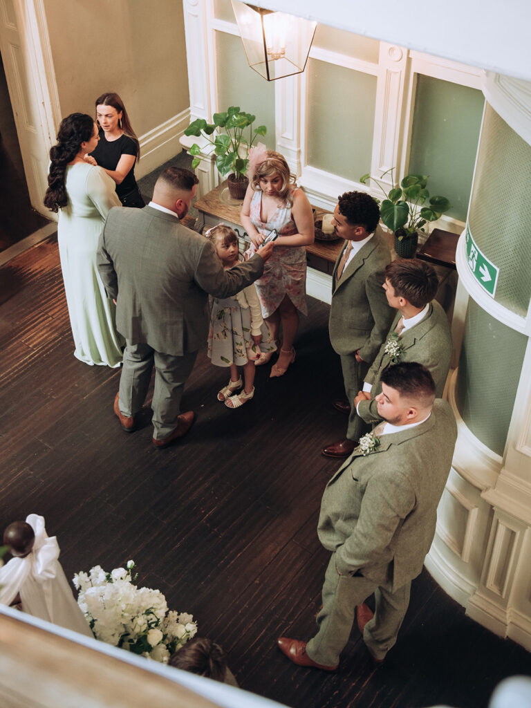 groom and ushers waiting to go in to ceremony