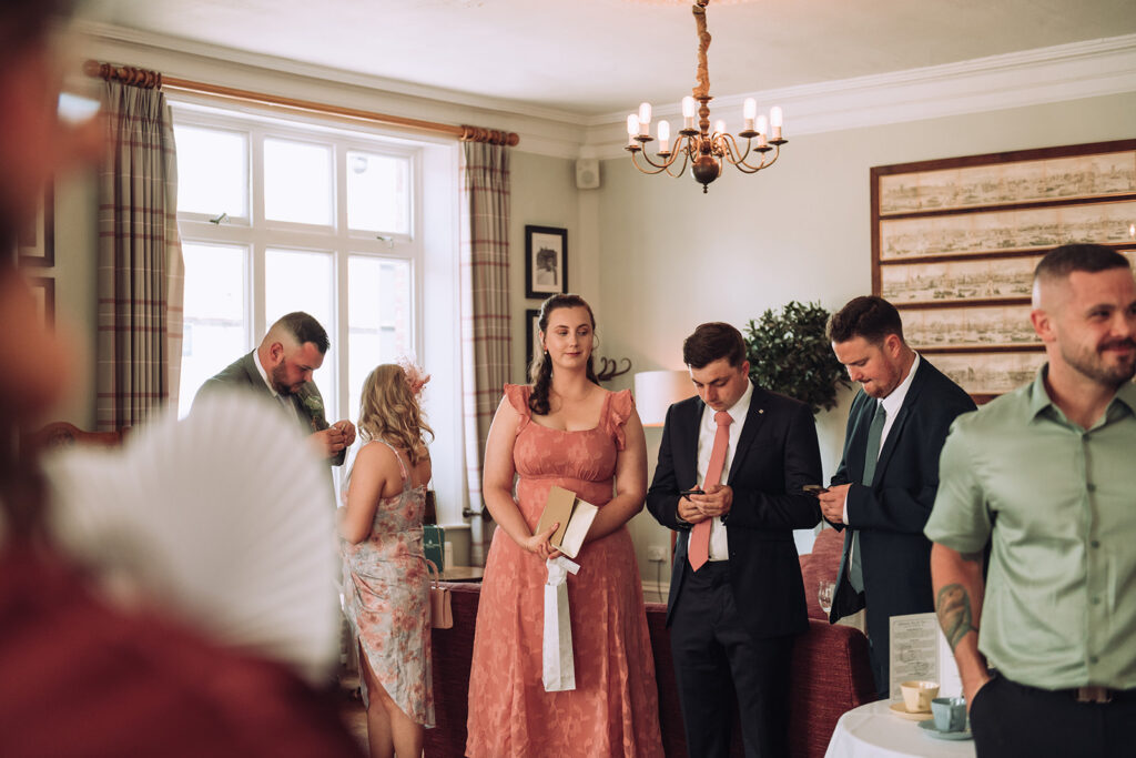 wedding guests waiting to go into ceremony