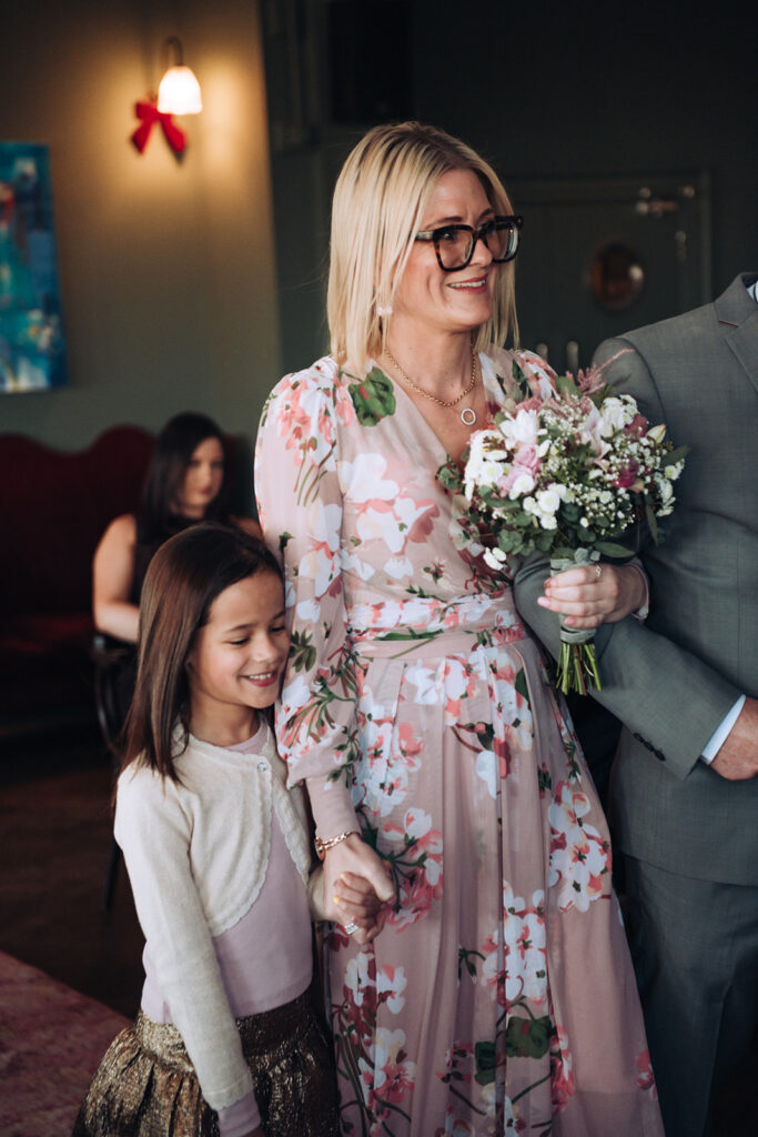Bride and daughter walking down the aisle