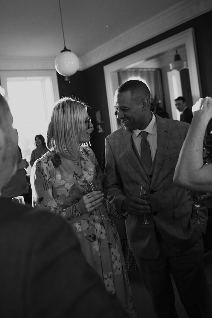 Bride and groom having champagne together