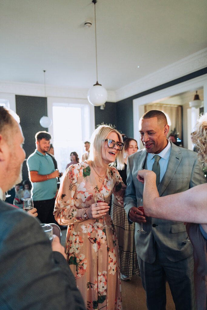 Bride and groom chatting to guests at their wedding in Kent