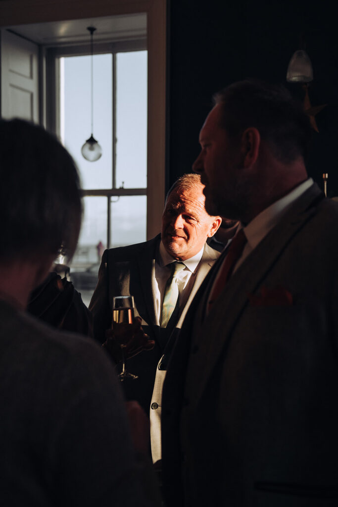 Father of the bride chatting with guests