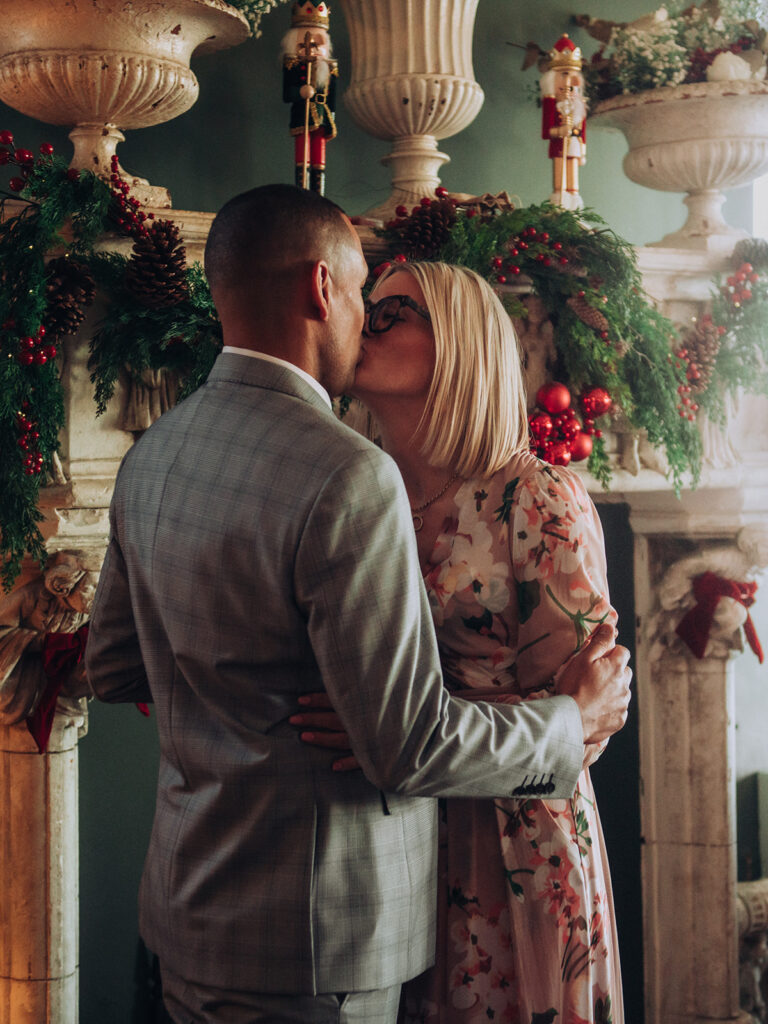 Bride and groom exchanging first kiss at Albion House