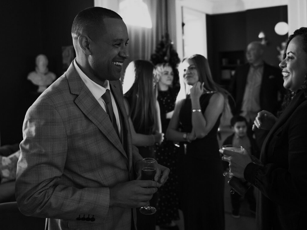 Groom laughing with sister at the house in Ramsgate