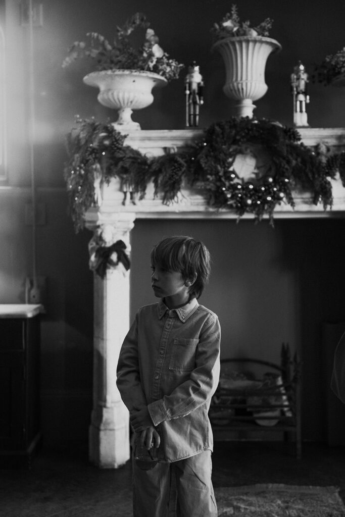 Page boy waiting at the end of the aisle at wedding