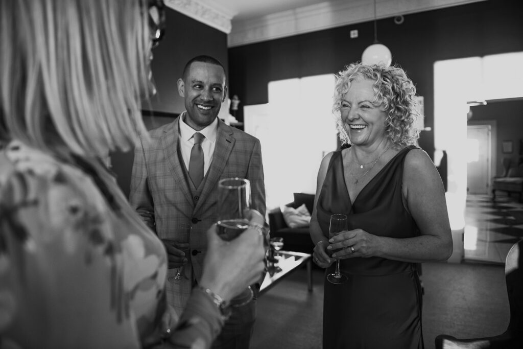 Wedding celebrant chatting with bride and groom