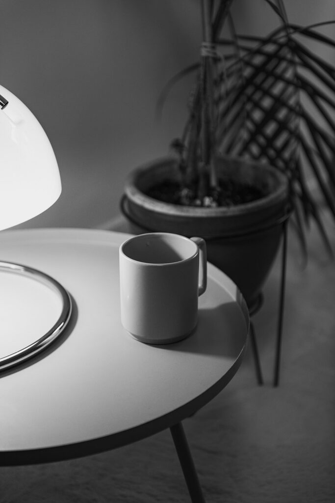 Mug of coffee on table