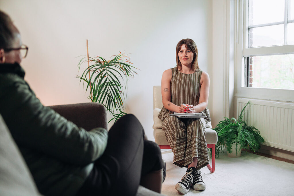 Therapist talking to a client