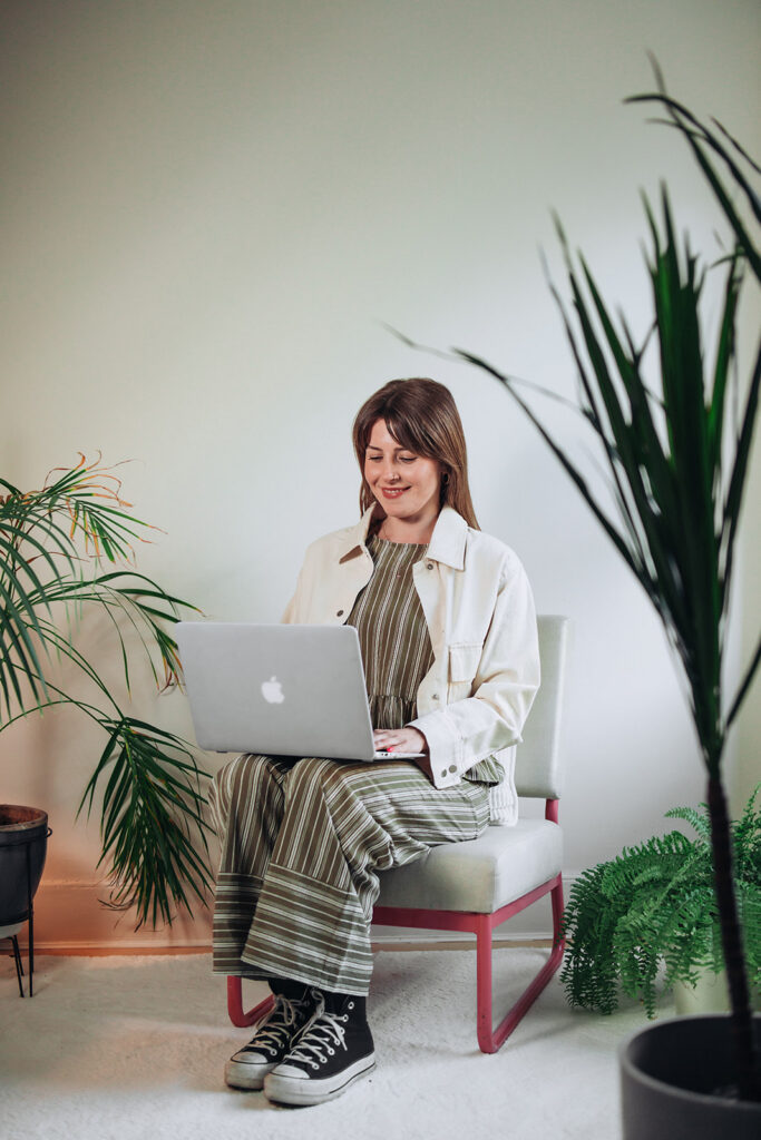 Therapist typing on laptop