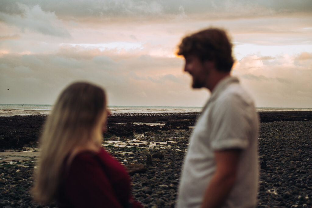 Seagulls with newly engaged couple blurry