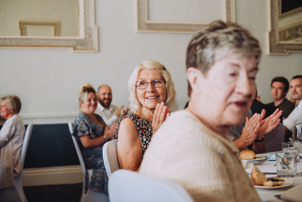 Guests clapping at birthday party in Kent