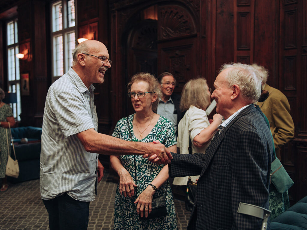 Old friends shaking hands
