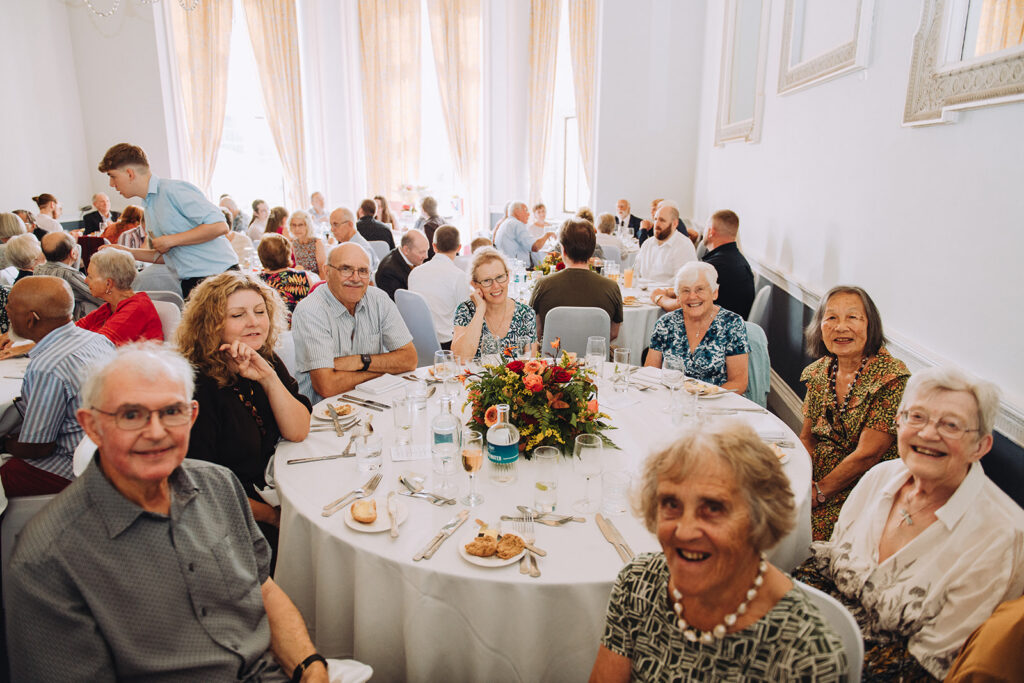 Guests round a table at party