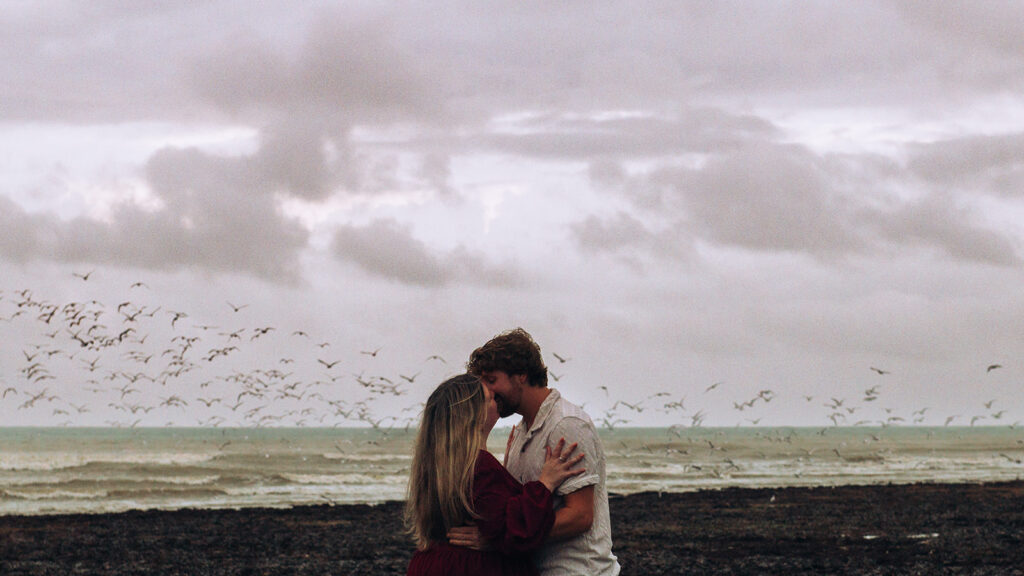 Kingsdown beach proposal photographer kiss in front of seagulls