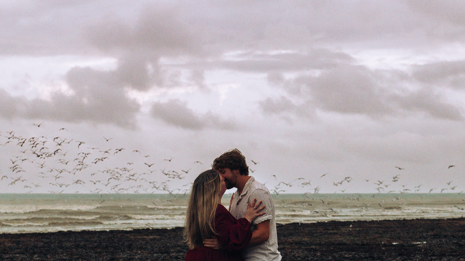 Kingsdown beach proposal photographer kiss in front of seagulls