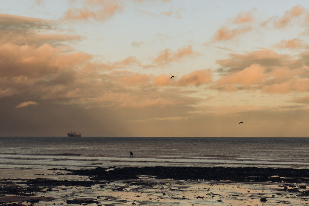 Surfer on Kingsdown beach in Kent