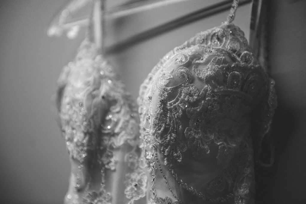 Photograph of the bride's dress hanging up for her Summer Wedding in Sandwich, Kent.