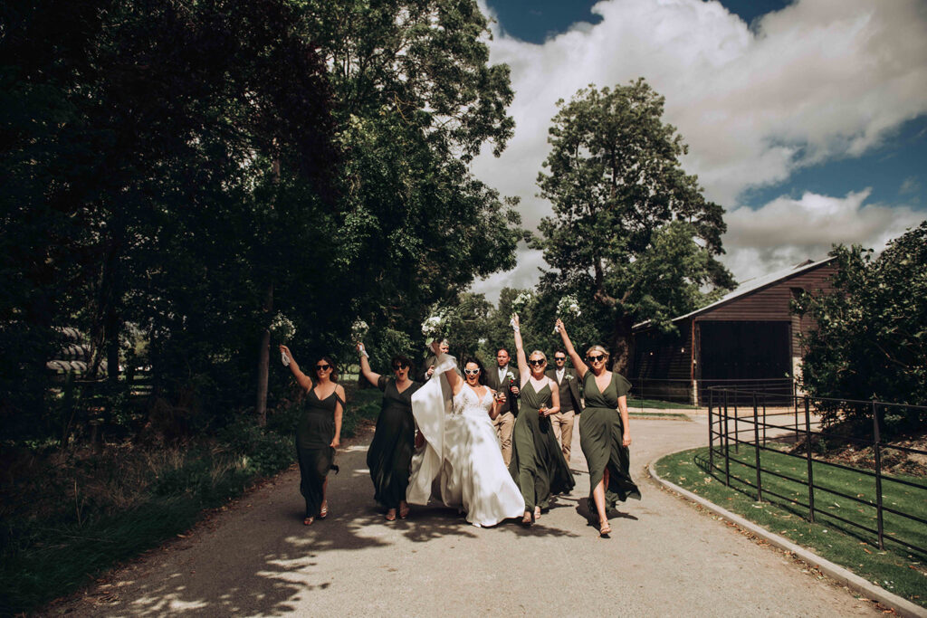 Editorial vs Traditional Wedding Photography - this is an editorial shot of a bride and her bridesmaids