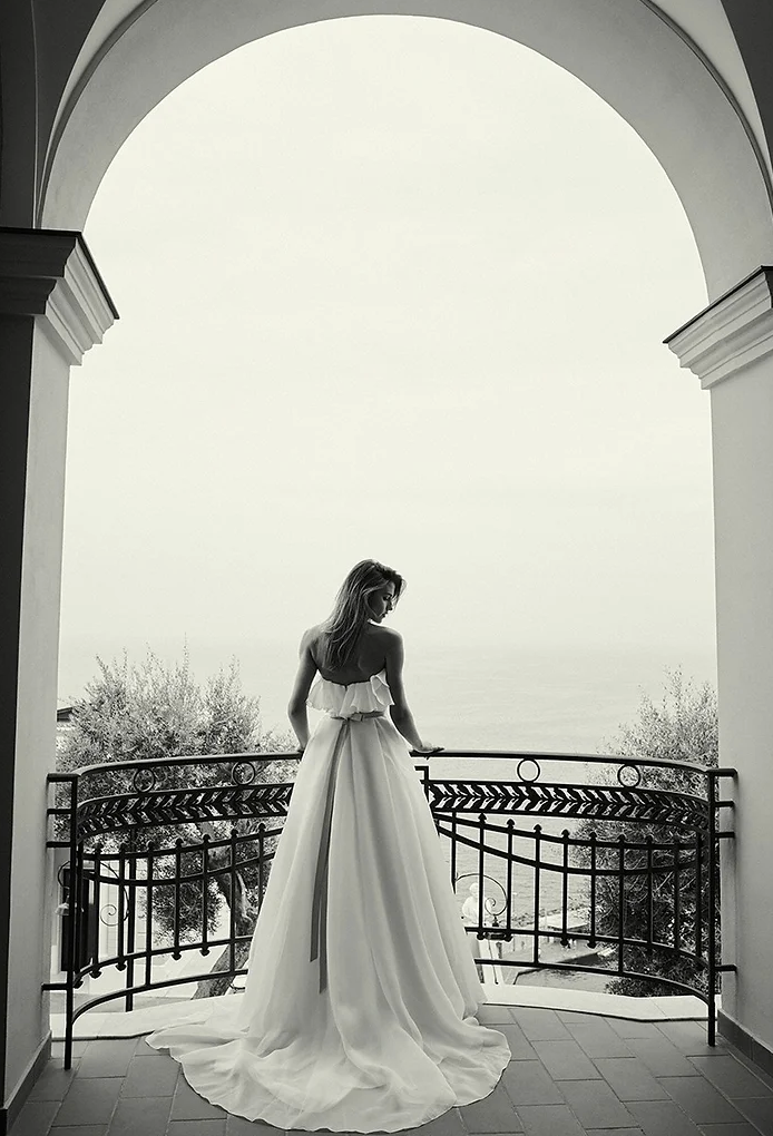 Monochrome photograph of a bride in a dress, from luxury bridal boutique in Kent Amore Brides.