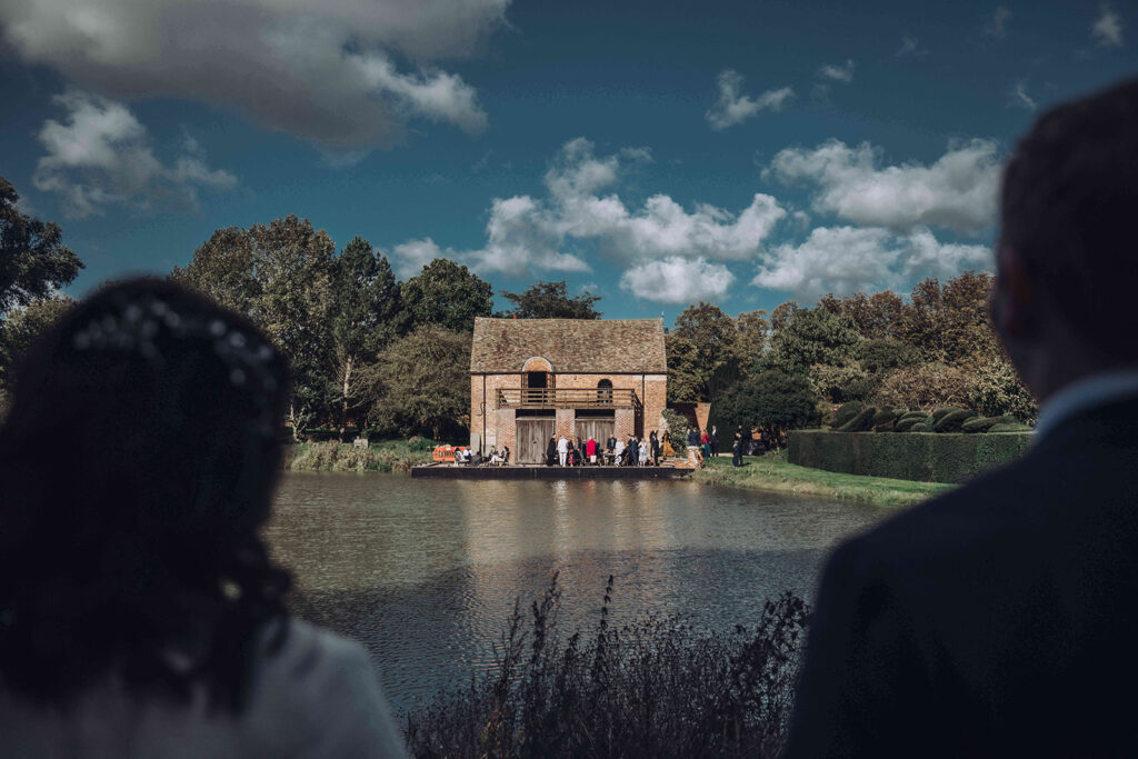 Bride and groom looking at their beautiful wedding venue called Childerley