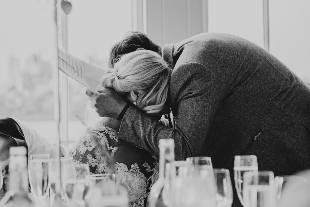 Bride being comforted by her father - documentary wedding photography in Kent