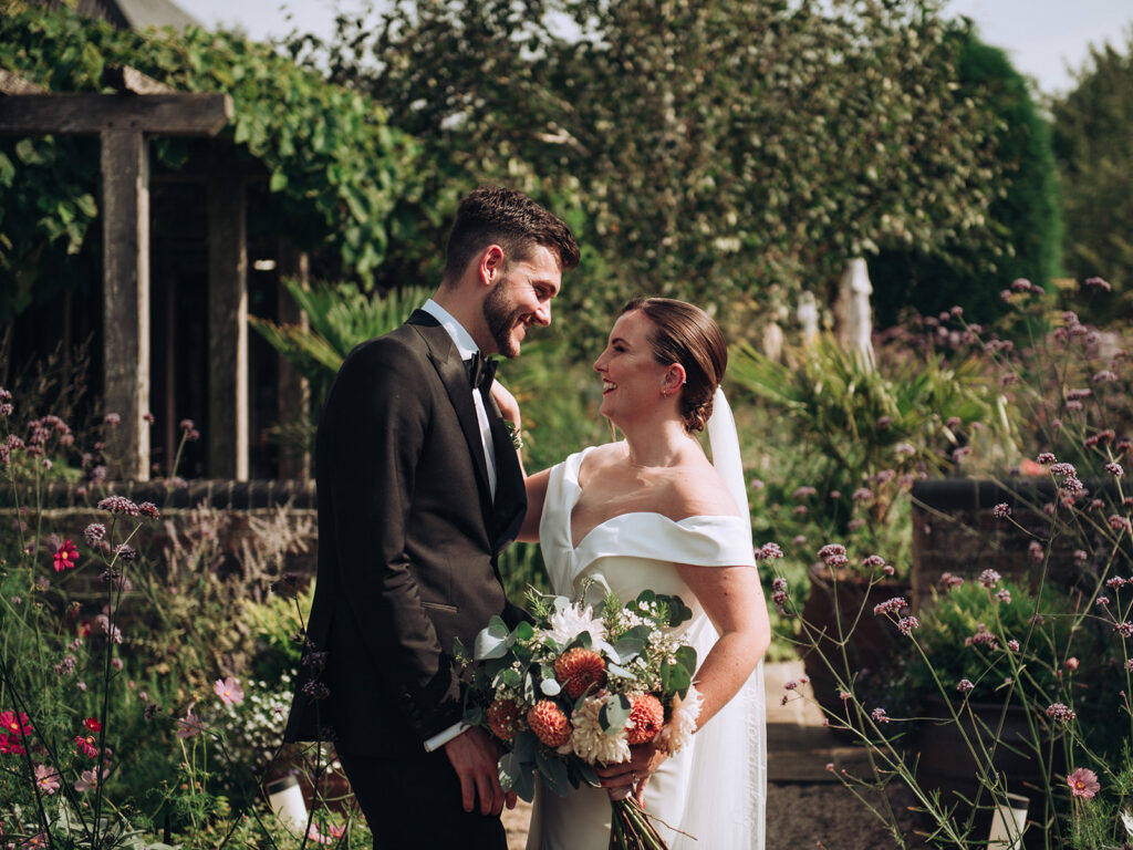 A couple stealing a moment at their luxury wedding venue, behind the scenes of Editorial Wedding Photography: A Luxury Couple's Shoot