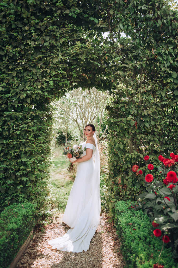 A bride smiling at her groom at her luxury wedding venue, behind the scenes of Editorial Wedding Photography: A Luxury Couple's Shoot