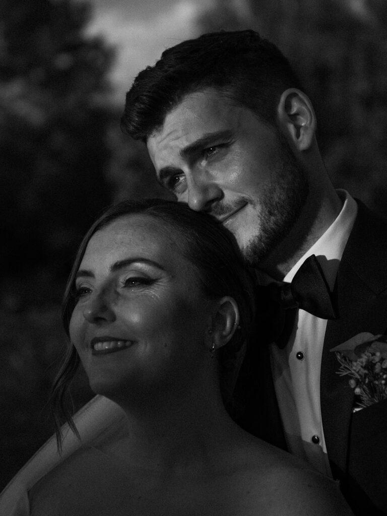 Monochrome image of a couple looking at the sunset