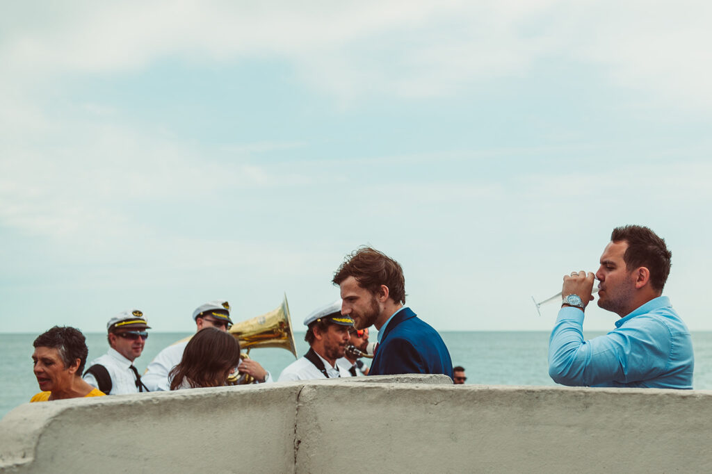 Wedding party on the beach in Deal Kent with trumpets