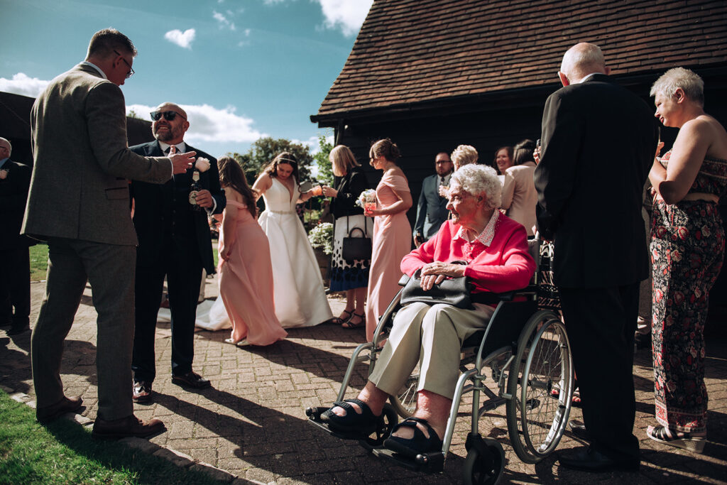 Great Nan looking at Bride celebrating wedding at The Old Kent Barn