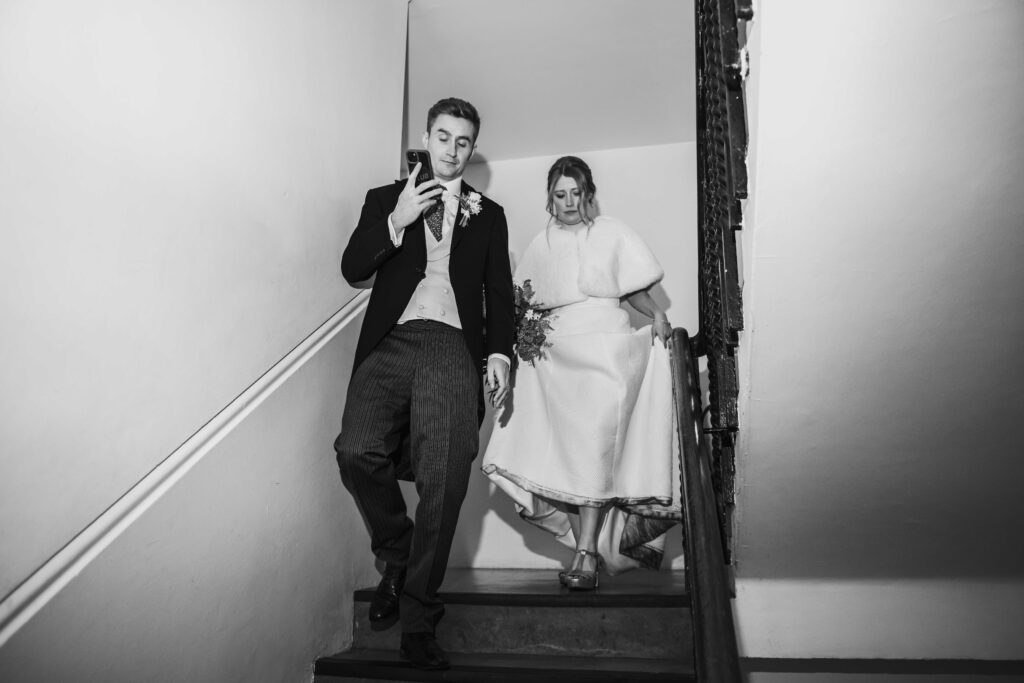 Editorial shot of a couple walking down stairs